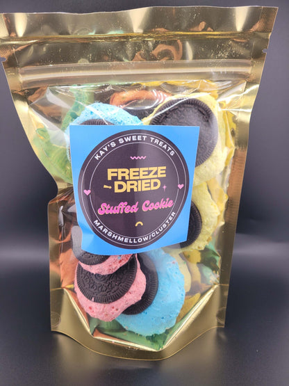 Stuffed cookies with colorful exterior and marshmallow filling in packaging.